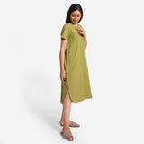 Right View of a Model wearing Khaki Green Cotton Flax High-Low Midi Dress