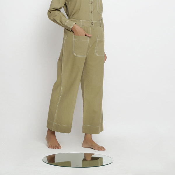 Right View of a Model wearing Khaki Green Vegetable Dyed Handspun Cotton Patch Pocket Wide Legged Pant