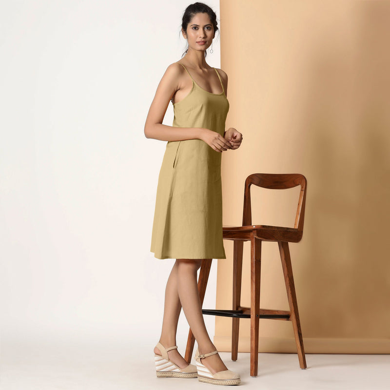 Right View of a Model wearing Khaki Sage Cotton Flax Strappy Slit Dress