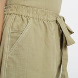 Right Detail of a Model wearing Khaki Green Vegetable Dyed Cotton Elasticated Short Shorts