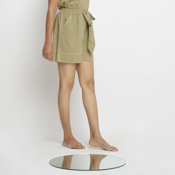Right View of a Model wearing Khaki Green Vegetable Dyed Cotton Elasticated Short Shorts