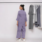 Back View of a Model wearing Lavender 100% Linen Comfort Fit High Neck Jumpsuit