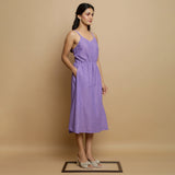 Right View of a Model wearing Hand-Embroidered Lavender Godet Dress