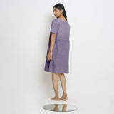 Back View of a Model wearing Lavender 100% Linen Knee Length Yoked Dress