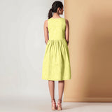 Back View of a Model wearing Lemon Yellow Gathered Yoke Dress
