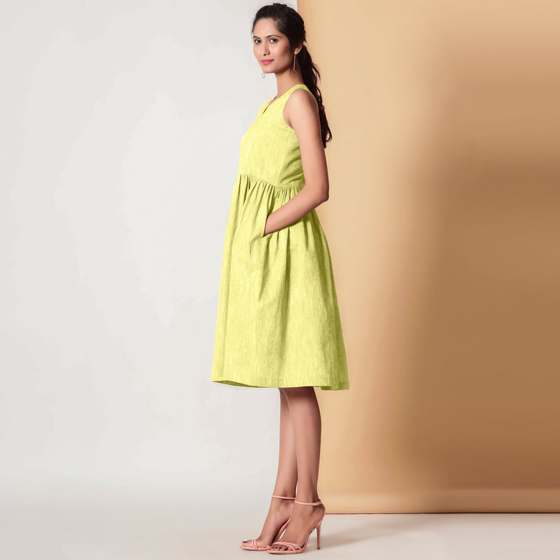 Left View of a Model wearing Lemon Yellow Gathered Yoke Dress
