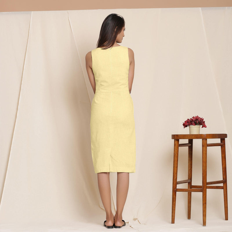 Back View of a Model wearing Lemon Yellow Knee Length Cotton Sheath Dress