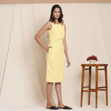 Right View of a Model wearing Lemon Yellow Knee Length Cotton Sheath Dress