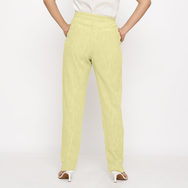 Back View of a Model wearing Lemon Yellow Yarn Dyed Mid Rise Tapered Pant
