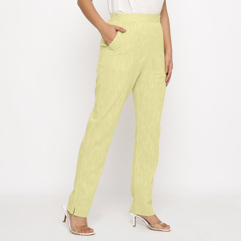 Right View of a Model wearing Lemon Yellow Yarn Dyed Mid Rise Tapered Pant