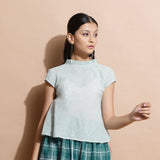 Front View of a Model wearing Light Green Cotton Muslin Ruffled Collar Flared Top