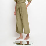 Left View of a Model wearing Light Green Vegetable Dyed Wide Legged Pant