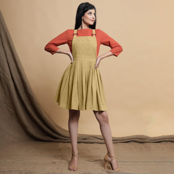 Front View of a Model wearing Light Khakhi Cotton Flax Knee Length Criss-Cross Back Dress
