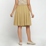 Back View of a Model wearing Light Khaki Cotton Flax Pleated Skirt