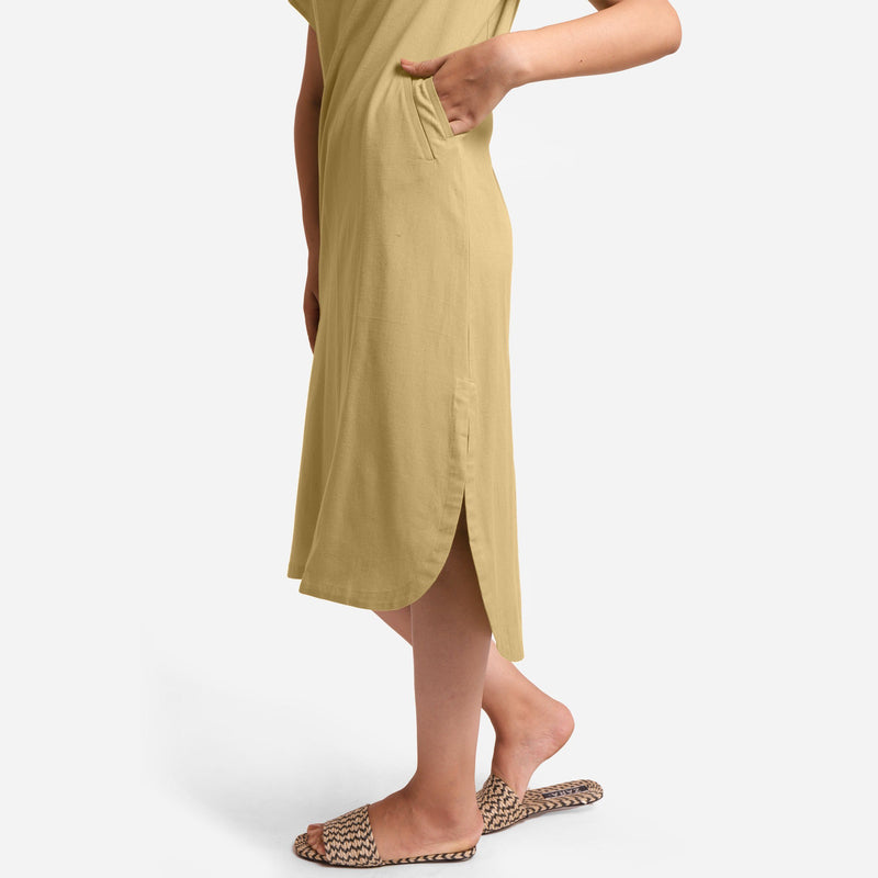 Left View of a Model wearing Light Khaki Cotton Welt Pocket Shift Dress