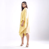 Left View of a Model wearing Light Yellow 100% Cotton Kaftan