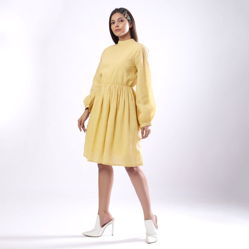 Front View of a Model wearing Light Yellow Backless Gathered Dress