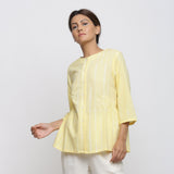 Front View of a Model wearing Light Yellow Cotton Button-Down Top