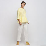 Right View of a Model wearing Light Yellow Cotton Button-Down Top