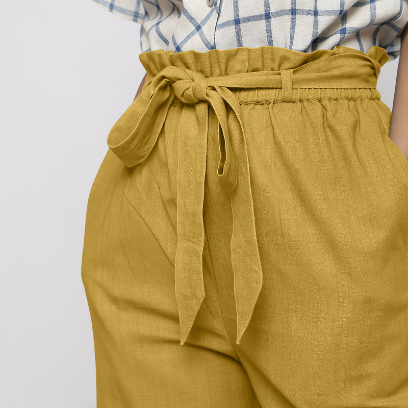 Front Detail of a Model wearing Light Yellow Vegetable Dyed Handspun Cotton Elasticated Wide Legged Paperbag Pant