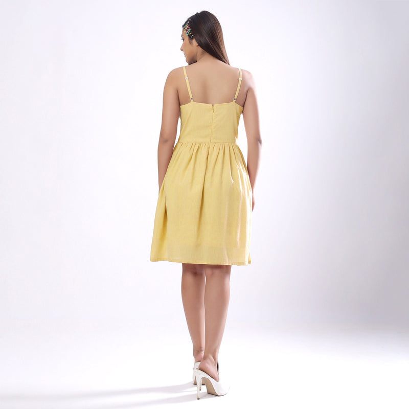 Back View of a Model wearing Light Yellow Handspun Camisole Dress