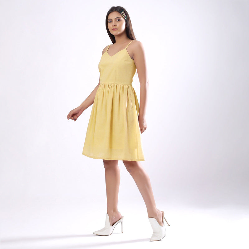 Left View of a Model wearing Light Yellow Handspun Camisole Dress