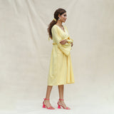 Right View of a Model wearing Light Yellow Handspun Cotton Bohemian Midi Dress