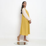 Right View of a Model wearing Light Yellow Handspun Cotton Deep Neck Shift Dress