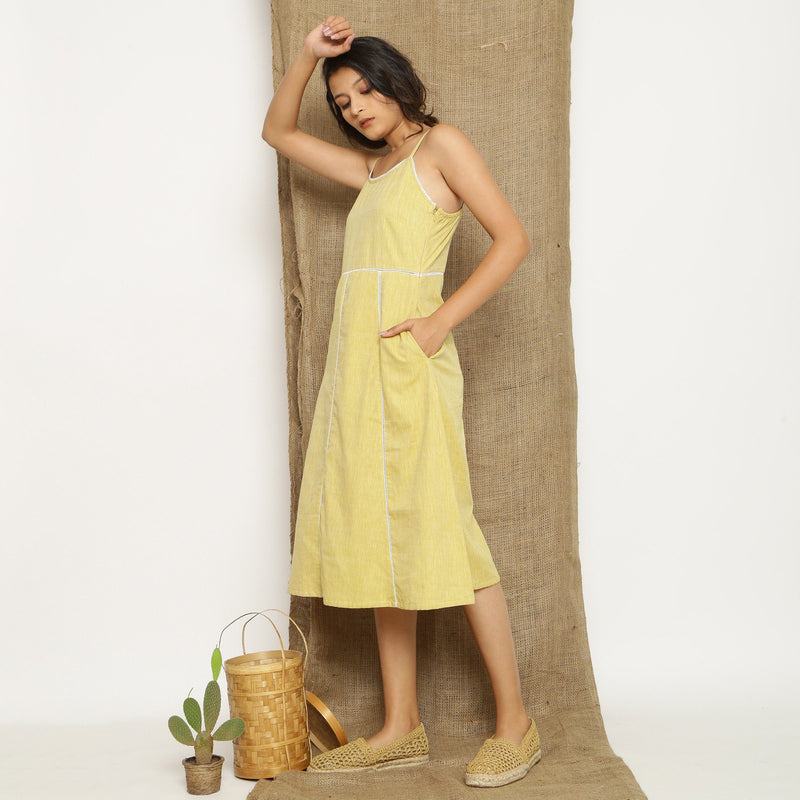 Left View of a Model wearing Light Yellow Handspun Cotton Lace Camisole Dress