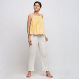 Front View of a Model wearing Light Yellow Tie Dye Strappy Camisole Top