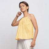 Left View of a Model wearing Light Yellow Tie Dye Strappy Camisole Top