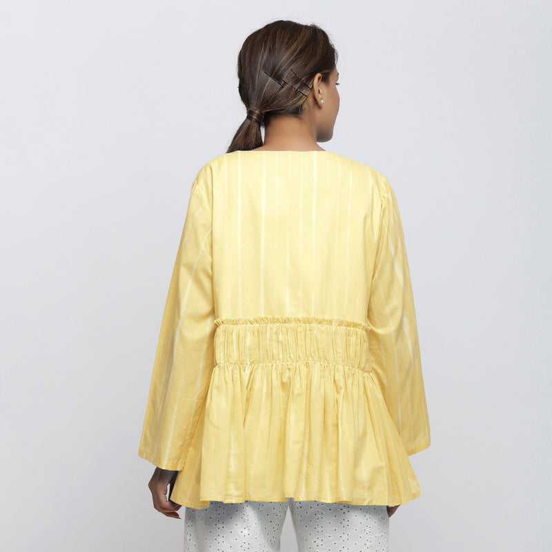 Back View of a Model wearing Light Yellow Tie Dyed Anti-Fit Outerwear