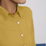 Front Detail of a Model wearing Light Yellow Vegetable Dyed 100% Cotton Button-Down Shirt