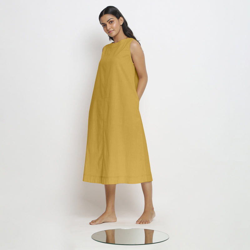 Left View of a Model wearing Light Yellow Vegetable Dyed A-Line Paneled Dress
