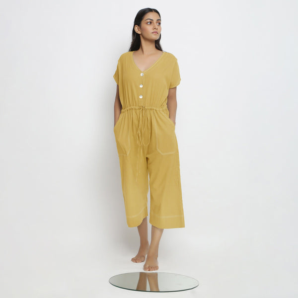Front View of a Model wearing Light Yellow Vegetable Dyed Button-Down Jumpsuit