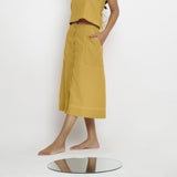 Left View of a Model wearing Light Yellow Vegetable Dyed Button-Down Skirt