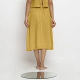 Back View of a Model wearing Light Yellow Vegetable Dyed Button-Down Skirt