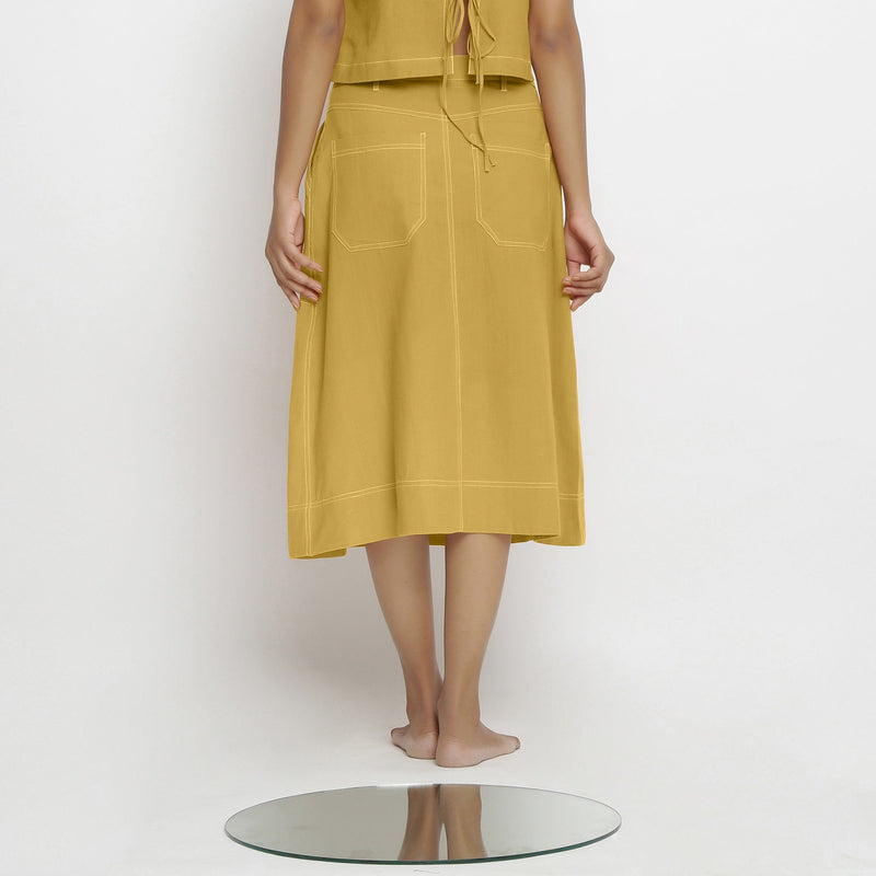 Back View of a Model wearing Light Yellow Vegetable Dyed Button-Down Skirt