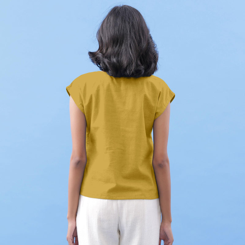 Back View of a Model wearing Light Yellow Vegetable Dyed Handspun Cotton Essential Top