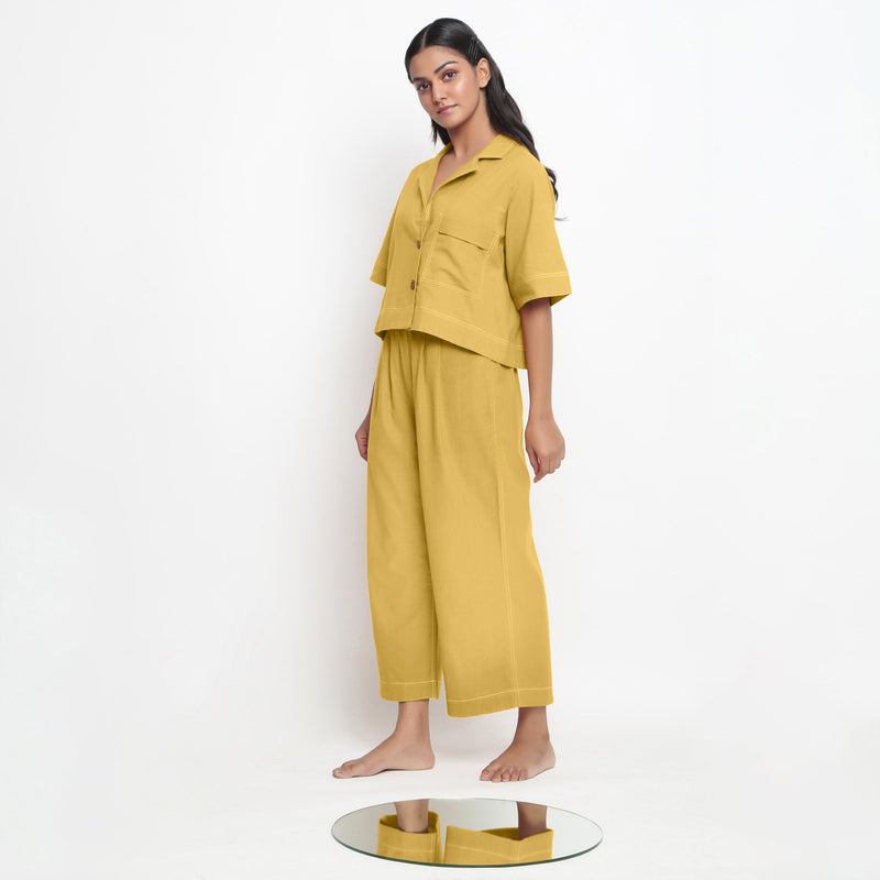 Left View of a Model wearing Light Yellow Vegetable Dyed Wide Legged Pant