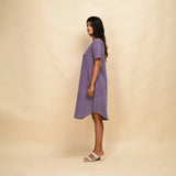 Left View of a Model wearing Lilac 100% Cotton Knee Length Dress