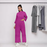 Front View of a Model wearing Magenta 100% Linen High Neck Jumpsuit
