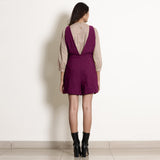 Back View of a Model wearing Magenta Frilled Waist Romper