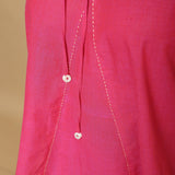 Front Detail of a Model wearing Magenta Hand-Embroidered Flared Top