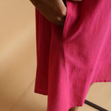 Right Detail of a Model wearing Magenta Hand-Embroidered Godet Dress
