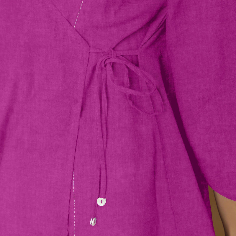 Close View of a Model wearing Magenta Embroidered Linen Asymmetrical Godet Top