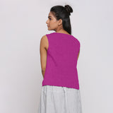Back View of a Model wearing Magenta Linen Split Neck Button-Down Sleeveless Top