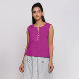 Front View of a Model wearing Magenta Linen Split Neck Button-Down Sleeveless Top