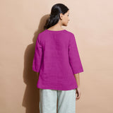 Back View of a Model wearing Magenta 100% Linen Split-Neck Tunic Top