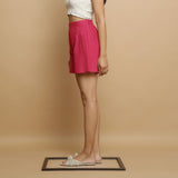 Left View of a Model wearing Magenta Mangalgiri Cotton Mid Rise Shorts